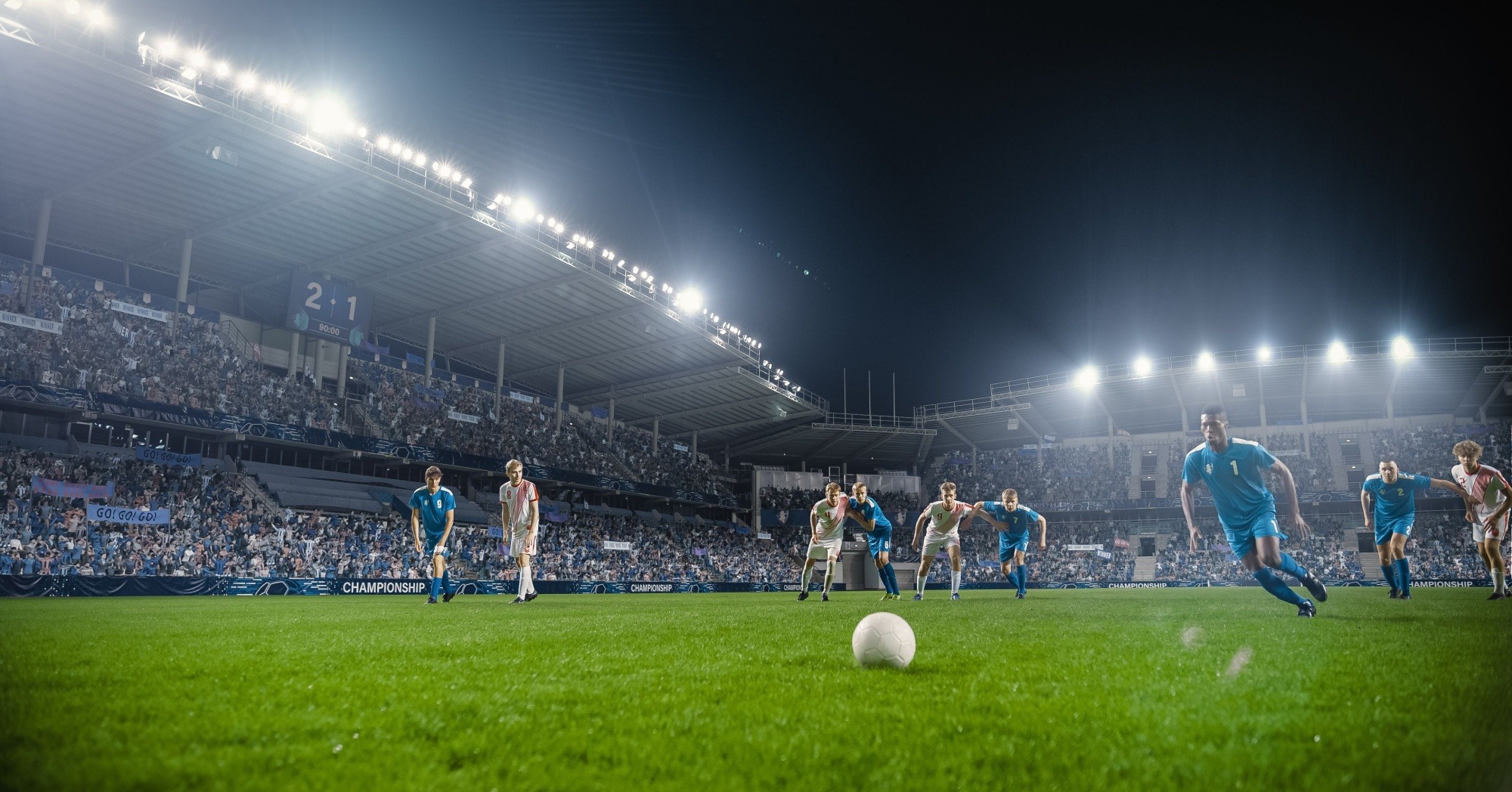 football players playing football in a stadium